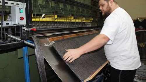 Georgia manufacturing has a long history in textiles, carpeting and other kinds of flooring. The $420 million purchase of a German-based company may not add production here, but it gives Atlanta-based Interface greater global heft. (AJC file photo)