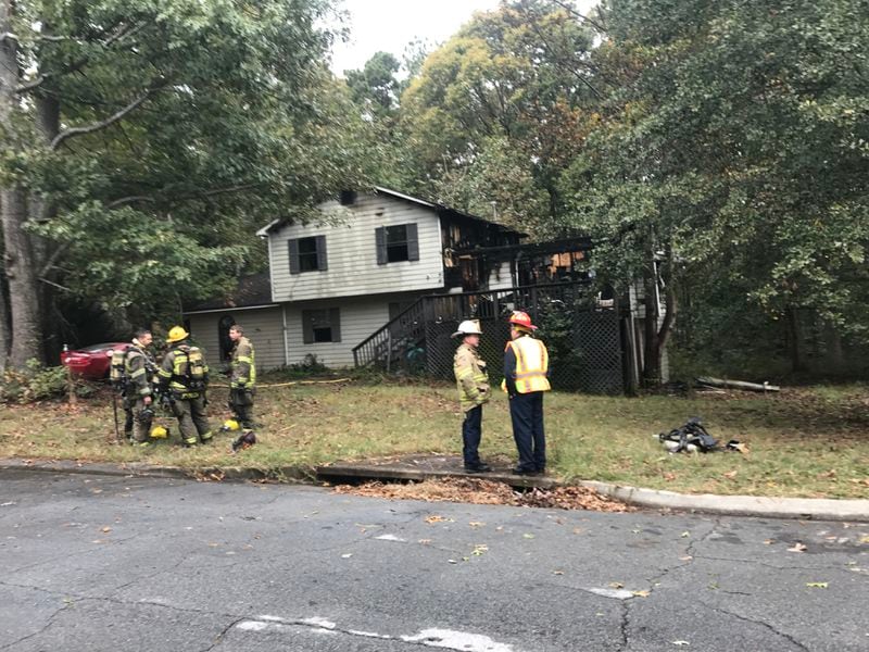 The fire on Luke Court in Buford is out, but one person was taken to the hospital with life-threatening injuries. (Credit: Channel 2 Action News)