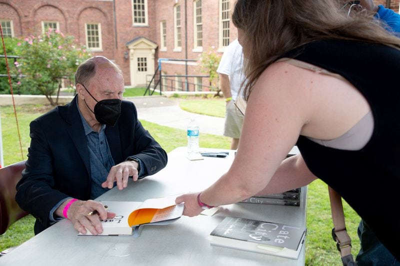 Pulitzer Prize-winning author Robert Olen Butler autographs a copy of his book for Rebecca Grapevine at the AJC Decatur Book Festival presented by Emory University at the First Baptist Church of Decatur Saturday, October 2, 2021. STEVE SCHAEFER FOR THE ATLANTA JOURNAL-CONSTITUTION