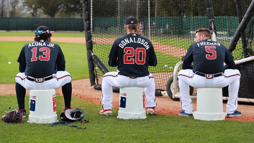 Braves players Ronald Acuna (from left), Josh Donaldson, and Freddie Freeman wait their turn to bat during the first full squad workout Thursday, Feb. 21, 2019, in Lake Buena Vista, Fla.