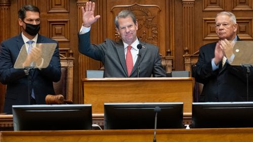 Gov. Brian Kemp, flanked by Lt. Gov. Geoff Duncan, left, and House Speaker David Ralston, R-Blue Ridge, before delivering the State of the State address to a joint session of the Georgia Legislature on Thursday morning, Jan. 13, 2022. Kemp announced during his speech plans to provide more money for the state's public colleges and universities. (Ben Gray for The Atlanta Journal-Constitution)