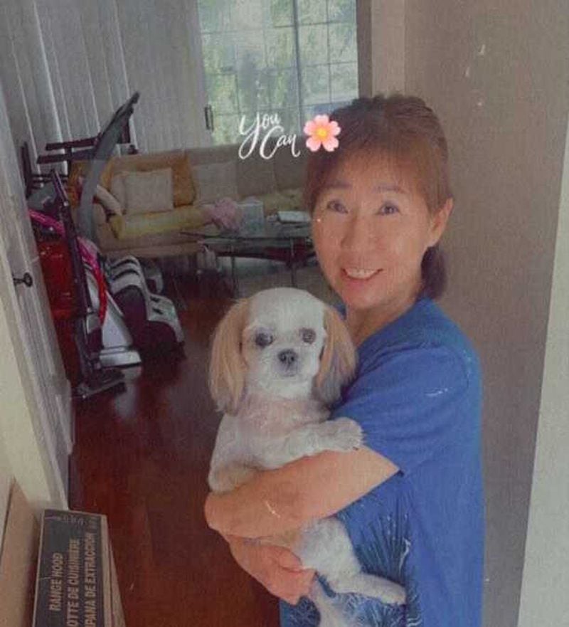 Yong Ae Yue with her Shih Tzu mix, Iyong. (credit: Family photo)