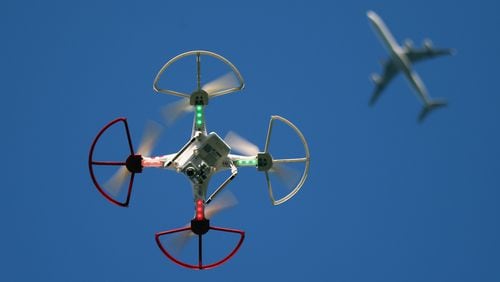 OLD BETHPAGE, NY - SEPTEMBER 05: A drone is flown for recreational purposes as an airplane passes nearby in the sky above Old Bethpage, New York on September 5, 2015. (Photo by Bruce Bennett/Getty Images)
