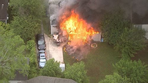 The house on Dresden Drive near Skyland Drive was engulfed in flames Wednesday morning.