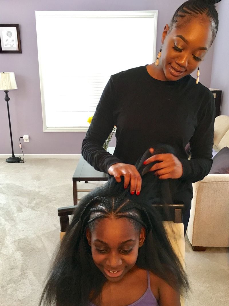 Colour stylist Mosi Cross creates a Shuri-inspired look for client Bailey Braxton. Bailey was inspired to add braids to her bun, like Princess Shuri in the “Black Panther” movie, for an upcoming dance audition. CONTRIBUTED