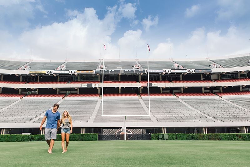 Former Georgia quarterback Matthew Stafford returned to Sanford Stadium with his fiancee, Kelly Hall, for their engagement photos. The couple, who have been together for six years, are to marry in April. More images available at Vue Photography