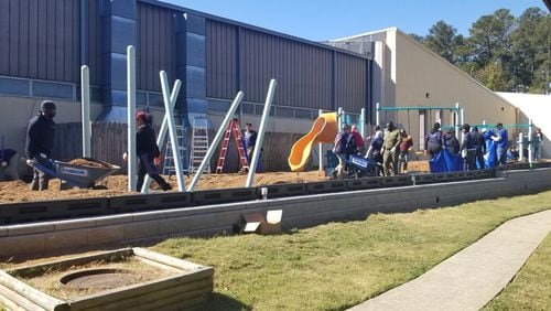 More than 150 volunteers helped install a kid-designed playground at the J.M. Tull-Gwinnett Family YMCA in Lawrenceville. COURTESY YMCA OF METRO ATLANTA
