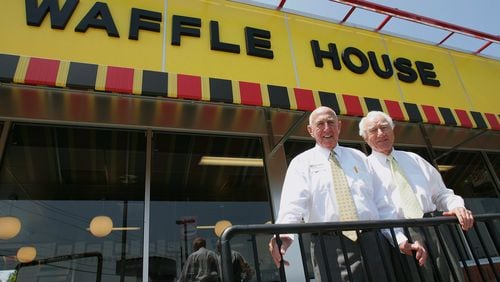 In this 2005 photo, Waffle House founders Joe Rogers Sr., left, and Thomas Francis Forkner Sr. pose in front of a restaurant in Norcross. Forkner, who jumped from real estate to the restaurant business when he co-founded Waffle House in the 1950s, has died weeks after the death of his business partner who helped him create the famous Southern diner chain. (AP Photo/Ric Feld, File)