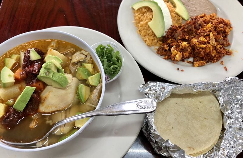 Mexican caldo de pollo (chicken soup) and a breakfast dish of scrambled eggs and chorizo; rice; refried beans; avocado and salty cotija cheese are served beginning at 7 a.m. six days a week at Don Burrito in Forest Park. CONTRIBUTED BY WENDELL BROCK
