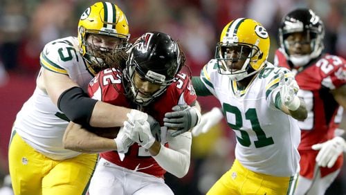 Jalen Collins (32) of the Atlanta Falcons is tackled by Bryan Bulaga (75) of the Green Bay Packers in the second half in the NFC Championship Game at the Georgia Dome on January 22, 2017 in Atlanta, Georgia.  (Photo by Streeter Lecka/Getty Images)