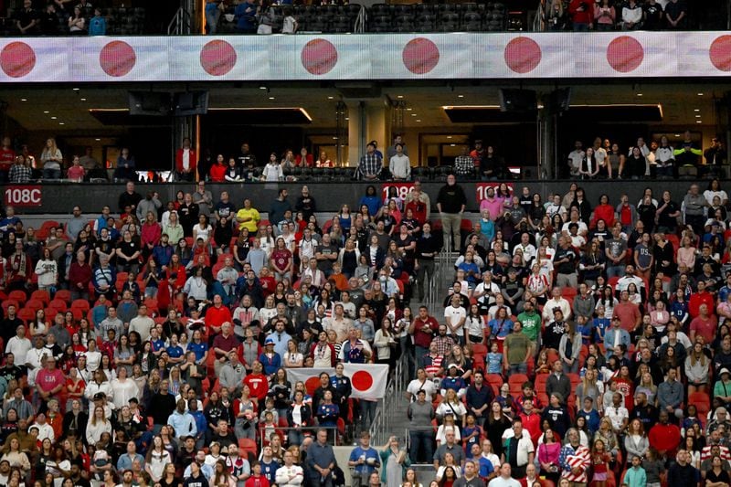 Fans hold a Japanese national flag before the SheBelieves Cup women's soccer match between the U.S. and Japan at Mercedes-Benz Stadium, Saturday, April 6, 2024, in Atlanta. (Hyosub Shin / Hyosub.Shin@ajc.com)