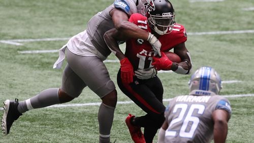 Falcons wide receiver Julio Jones makes a first-down reception against the Detroit Lions during the first half Sunday, Oct. 25, 2020, at Mercedes-Benz Stadium in Atlanta. (Curtis Compton / Curtis.Compton@ajc.com)