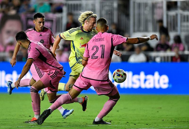 New York Red Bulls midfielder Emil Forsberg advances the ball past Inter Miami defender Nicolás Freire (21) during the second half of an MLS soccer game, Saturday, May 4, 2024, in Fort Lauderdale, Fla. (AP Photo/Michael Laughlin)