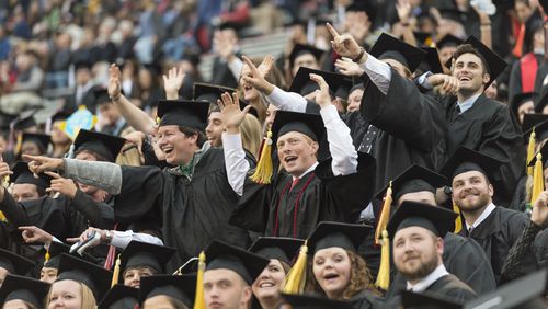 May 5, 2017, Athens - Students cheer during the University of Georgia's undergraduate commencement ceremony at Sanford Stadium in Athens, Georgia, on Friday, May 5, 2017. (DAVID BARNES / DAVID.BARNES@AJC.COM)