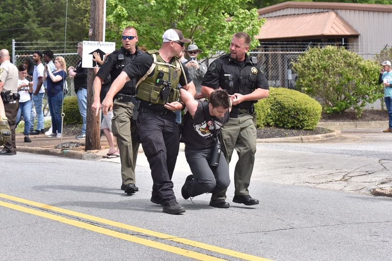 A neo-Nazi rally in Newnan on Saturday brought out counterprotesters and law enforcement agencies. Officers arrested some of those who were there to demonstrate against the neo-Nazis.