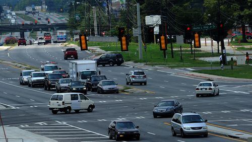 Vehicles travel through the intersection of Martin Luther King Jr. Drive and Fulton Industrial Boulevard. Gov. Nathan Deal has vetoed a measure that could have put the area into the new city of South Fulton. Johnny Crawford / AJC FILE PHOTO