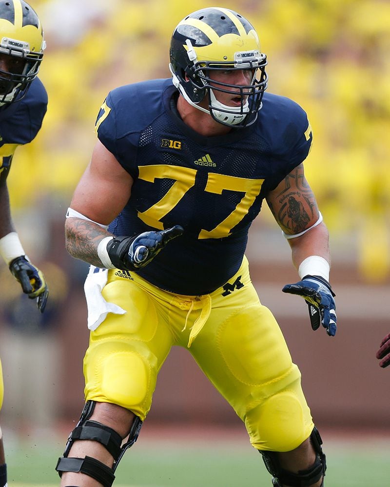 ANN ARBOR, MI - AUGUST 31: Taylor Lewan #77 of the Michigan Wolverines lines up with Louis Palmer #56 of the Central Michigan Chippewas during the first quarter at Michigan Stadium on August 31, 2013 in Ann Arbor, Michigan. (Photo by Gregory Shamus/Getty Images) ANN ARBOR, MI - AUGUST 31: Taylor Lewan #77 of the Michigan Wolverines lines up with Louis Palmer #56 of the Central Michigan Chippewas during the first quarter at Michigan Stadium on August 31, 2013 in Ann Arbor, Michigan. (Photo by Gregory Shamus/Getty Images)