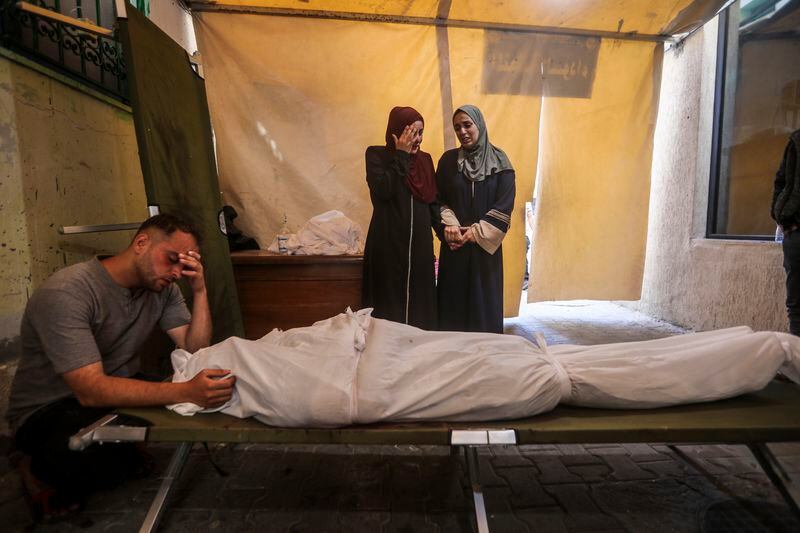 Palestinians mourn their relatives killed in the Israeli bombardment of the Gaza Strip, at a hospital in Rafah, Gaza, Friday, May 10, 2024. (AP Photo/Ismael Abu Dayyah)