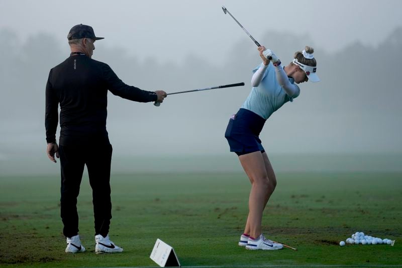 Instructor Jamie Mulligan works with Nelly Korda on the driving range prior to the second round of the Chevron Championship LPGA golf tournament Friday, April 19, 2024, at The Club at Carlton Woods, in The Woodlands, Texas. (AP Photo/David J. Phillip)