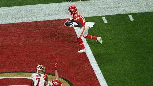 
                        Kansas City Chiefs wide receiver Mecole Hardman (12) scores the winning touchdown in overtime during Super Bowl LVIII against the San Francisco 49ers at Allegiant Stadium in Las Vegas on Sunday, Feb. 11, 2024. The Chiefs won 25-22. (Bridget Bennett/The New York Times)
                      