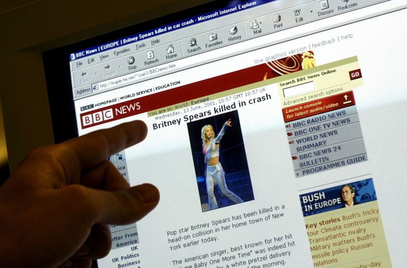 A web surfer looks at a website that falsely identifies itself as "BBC News" with links connecting it to the real "BBC News" and reports of the death of pop singer Britney Spears June 13, 2001 in London, England. (Photo by Sion Touhig/Getty Images)