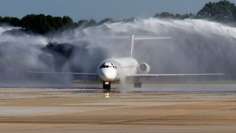The final passenger flight for the MD-88 jet receives a water cannon welcome as it taxis into the Hartsfield-Jackson Atlanta International Airport on June 2, 2020. STEVE SCHAEFER FOR THE ATLANTA JOURNAL-CONSTITUTION