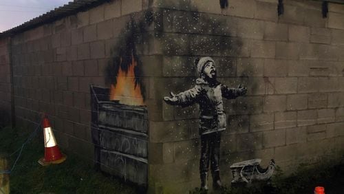 British street artist Banksy confirmed that art on a garage wall in Wales was done by him.