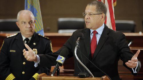Fulton County Commission Chairman John Eaves (right), standing beside Fulton county police chief Gary Stiles at a press conference, announced proposals to help reduce crime in south Fulton, where there has been an increase this year in car thefts and items stolen from cars. The ideas include a multi-jurisdictional police team to patrol gas stations and grants for increasing surveillance. BOB ANDRES /BANDRES@AJC.COM