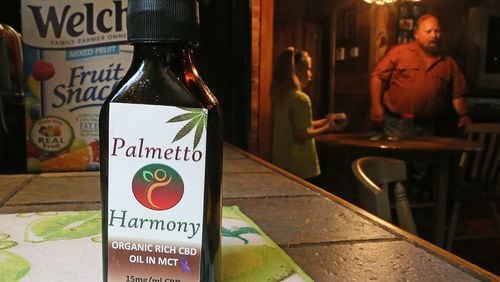 A bottle of Palmetto Harmony organic rich CBD oil in MCT sits on the counter along with fruit snacks at the home of J-Bo Wages and his 12-year-old daughter, Sydney, who suffers from intractable seizures and uses cannabis oil as a treatment on Tuesday, August 11, 2015, in Dallas. The Wages, who were among the very first to receive permission from the state to use low-dose cannabis oil without fear of prosecution, have seen some cognitive improvements in Sydney using the oil as a treatment. Curtis Compton / ccompton@ajc.com