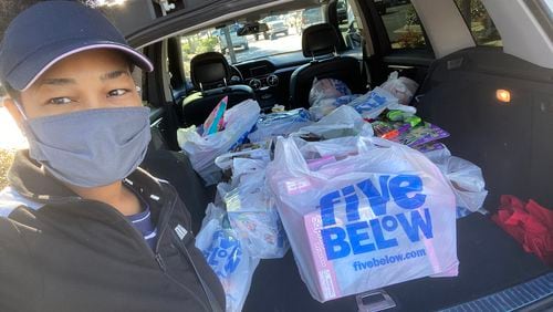Lucretia Cooper takes a selfie while loading donated toys into her van on Oct. 28, 2021. These toys will be delivered to various foster care homes in the Athens area. Courtesy of Lucretia Cooper