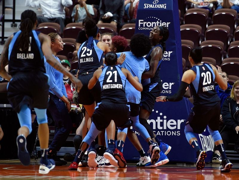 Tiffany Hayes gets mobbed by her Atlanta teammates after sinking a 50-foot game-winner.