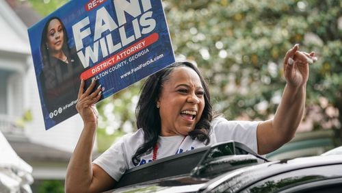 Fulton County District Attorney Fani Willis rides in a car while participating in the Inman Park Parade on Saturday, April 27, 2024, in Atlanta. (Elijah Nouvelage for The Atlanta Journal-Constitution)