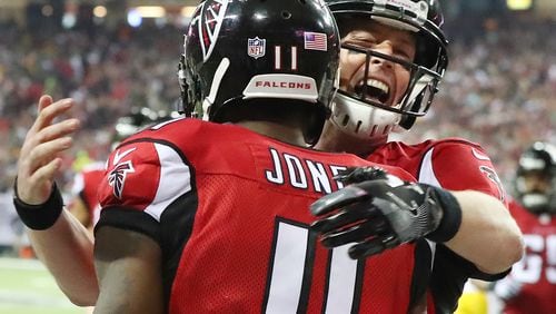 January 22, 2017, Atlanta: Matt Ryan celebrates with Julio Jones connecting for a 70-plus yard touchdown pass for a 31-0 lead over the Packers during the third quarter in the NFL football NFC Championship game on Sunday, Jan. 22, 2017, in Atlanta. Curtis Compton/ccompton@ajc.com