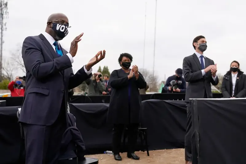 Stacey Abrams, shown campaigning with U.S. Sens. Raphael Warnock, left, and Jon Ossoff, is expected to challenge Gov. Brian Kemp in a repeat of 2018's narrow race.