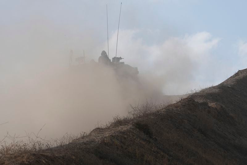 An Israeli tank moves to a position near the border with the Gaza Strip, in southern Israel, Tuesday, April 30, 2024. (AP Photo/Tsafrir Abayov)