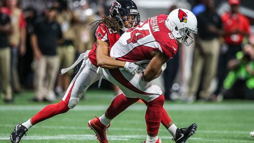August 26, 2017 Atlanta: Atlanta Falcons cornerback Jalen Collins (32) (left) snags Arizona Cardinals tight end Jermaine Gresham (84) during 2nd quarter action on Saturday, Aug. 26, 2017 at the opening of the brand new Mercedes Benz Stadium and pre-season NFL game between the Atlanta Falcons and the Arizona Cardinals. JOHN SPINK/JSPINK@AJC.COM