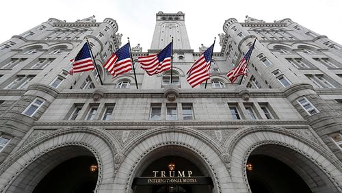 In this photo taken Dec. 21, 2016, the Trump International Hotel in Washington. Trump's $200 million hotel inside the federally owned Old Post Office building has become the place to see, be seen, drink, network, even live, for the still-emerging Trump set. It's a rich environment for lobbyists and anyone hoping to rub elbows with Trump-related politicos, despite the veil of ethics questions that hangs overhead.