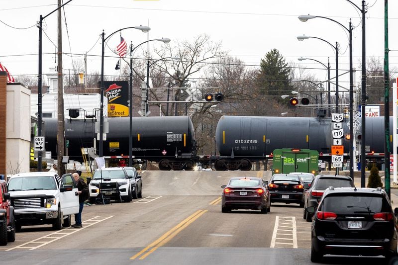 A train passes through East Palestine, Ohio, on Friday, Feb. 17, 2023. About 38 cars of a Norfolk Southern train derailed Feb. 3 in East Palestine. Among the derailed cars were five hazardous materials cars carrying vinyl chloride. (Arvin Temkar/The Atlanta Journal-Constitution/TNS)