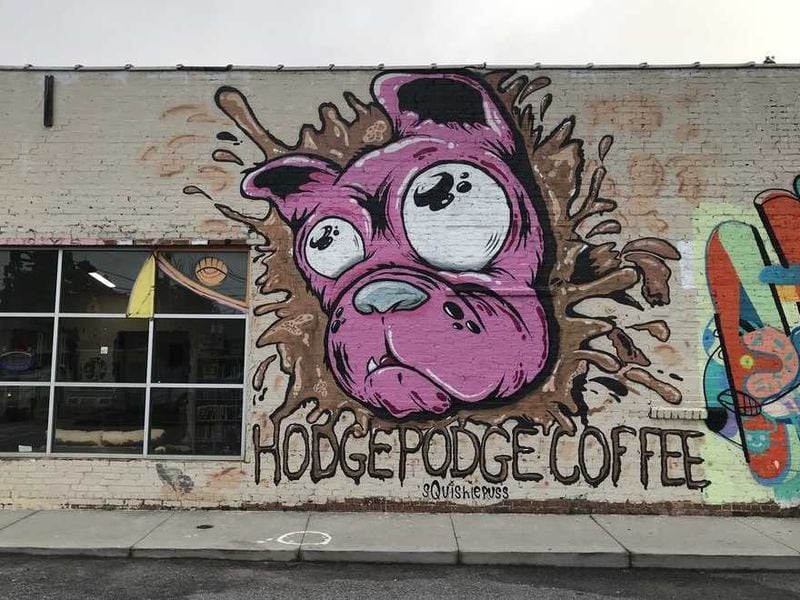 A mural by Atlanta-based artist Ray Geier previously at HodgePodge Coffeehouse and Gallery in Atlanta. The mural has now been covered with blue paint.