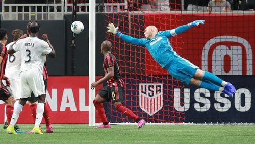 August 27, 2019 Atlanta: Atlanta United goalkeeper Brad Guzan defends a shot by Minnesota United Ike Opara during the first half in the final for the U.S. Open Cup on Tuesday, August 27, 2019, in Atlanta.  Curtis Compton/ccompton@ajc.com