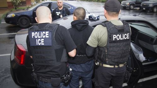In this Tuesday, Feb. 7, 2017, photo released by U.S. Immigration and Customs Enforcement, foreign nationals are arrested in Los Angeles. President Donald Trump wants local law enforcement to play a larger role in immigration enforcement.  (Charles Reed/U.S. Immigration and Customs Enforcement via AP)