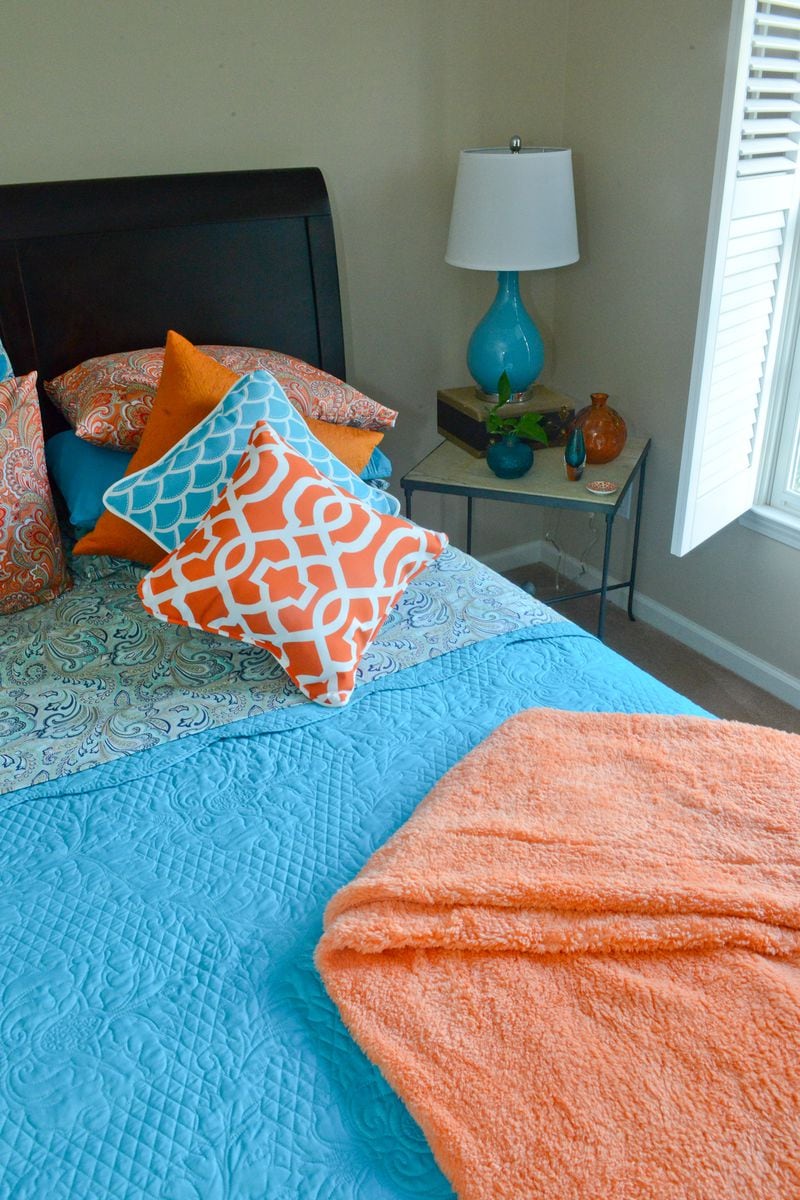 Bright bed linens and pillows welcome guests to Pedro Ayestaran Diaz's and Jeffrey Chandler's guest bedroom with vibrant pops of color. Text by Lori Johnston and Keith Still/Fast Copy News Service. Text by Lori Johnston and Keith Still/Fast Copy News Service. (Christopher Oquendo Photography/www.ophotography.com)