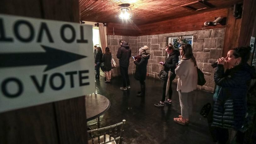 Voters lined up on Tuesday, Dec. 6, 2022 at the Park Tavern located at 500 10th Street NE in Atlanta. (John Spink / John.Spink@ajc.com)