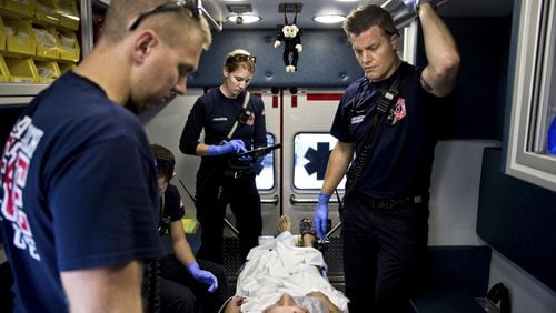 Paramedics treat a patient who overdosed on heroin in Delray Beach, Fla., on Feb. 2, 2017. Americans are more likely to die of an opioid overdose than in a car crash, according to a report by the National Safety Council that analyzed preventable deaths in 2017. Scott McIntyre/The New York Times