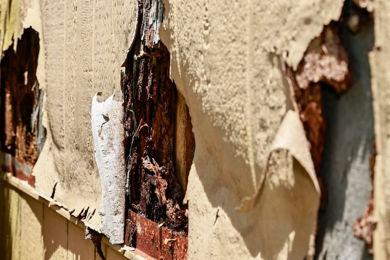 Selma Calaman says repairs aren’t being made and many of the buildings at Columbia Square have rotting siding.(Natrice Miller/natrice.miller@ajc.com)