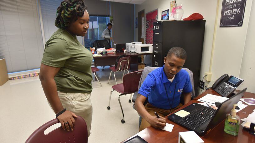 February 7, 2018 Atlanta - Valencia Dennis, student support coach, consults with Kyrsten Burch,18, during their Target 2021 program session at Maynard Jackson High School on Wednesday, Feb. 7, 2018. After a year and a half and $7.5 million, Atlanta Public Schools can show only mixed or inconclusive results for a program intended to support the student victims of a major cheating conspiracy. A recent evaluation of the Target 2021 program — named for the graduation year of the youngest Atlanta students caught up in the cheating conspiracy— shows scant evidence that the initiative is helping those children whose answers on standardized tests were changed by educators. HYOSUB SHIN / HSHIN@AJC.COM