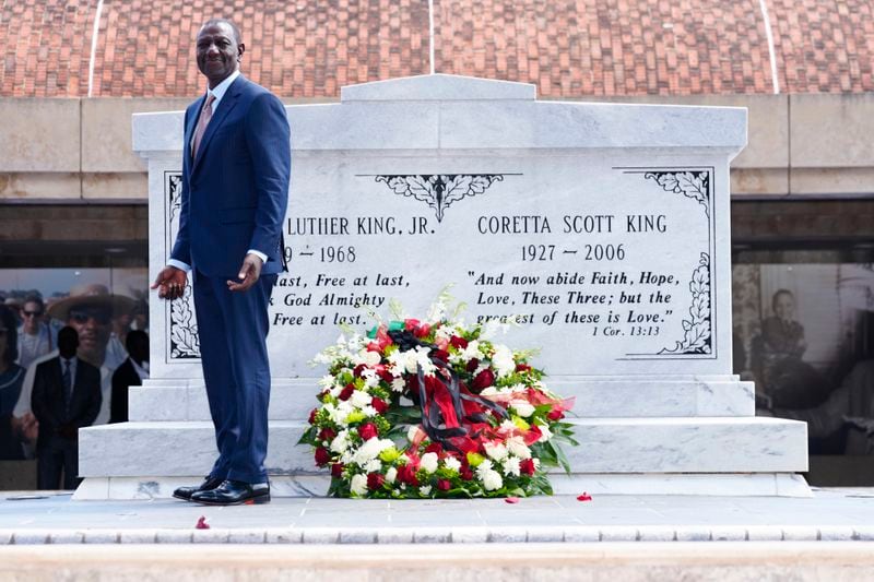 Kenya President William Ruto pauses after laying a wreath at the tombs of Martin Luther King Jr., and Coretta Scott King, during a visit to the King Center Monday, May 20, 2024, in Atlanta. (AP Photo/John Bazemore)