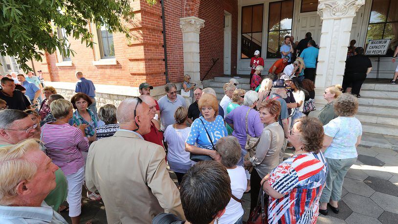 Hundreds of concerned citizens wait in line to get inside as Newton County holds two town hall meetings to discuss plans to build a mosque and cemetery in the county on Monday, August 22, 2016, in Covington. Curtis Compton /ccompton@ajc.com