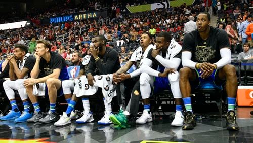 Atlanta Hawks team members watch from the bench during the final minute of an NBA basketball game against the Miami Heat, Friday, Feb. 24, 2017, in Atlanta. (AP Photo/John Amis)