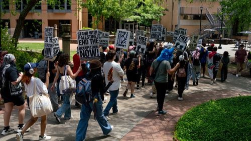 Kennesaw State University students gather and march across the campus. Students are demanding university divestment to Israel. Wednesday, May 1, 2024 (Ben Hendren for The Atlanta Journal-Constitution)